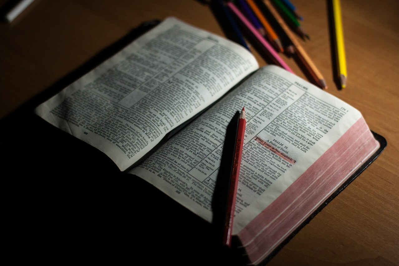 open Bible with color pens
