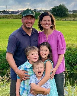 photo of Pastor Peter Rowan with his family outside