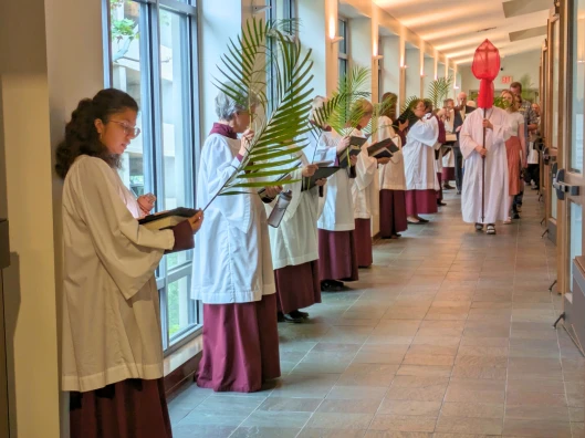 Palm Sunday Procession in corridor with windows