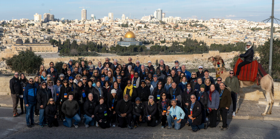 BFCal’s Holy Land Tour group poses on the Mount of Olives overlooking Jerusalem with Dr. Jonathan Jarboe on camelback.