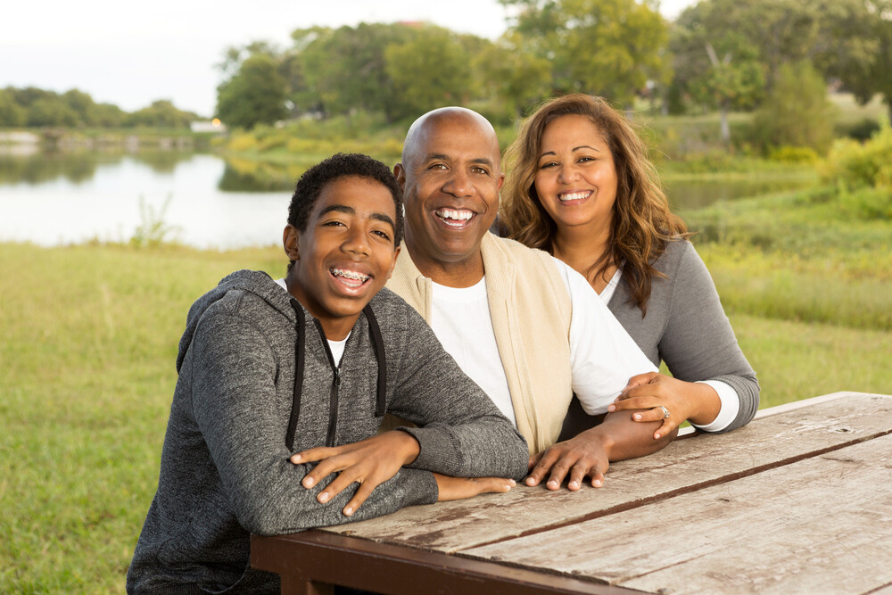 a-happy-teenage-boy-with-his-mom-and-dad