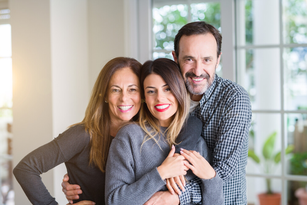 happy-teen-daughter-with-her-mom-and-dad