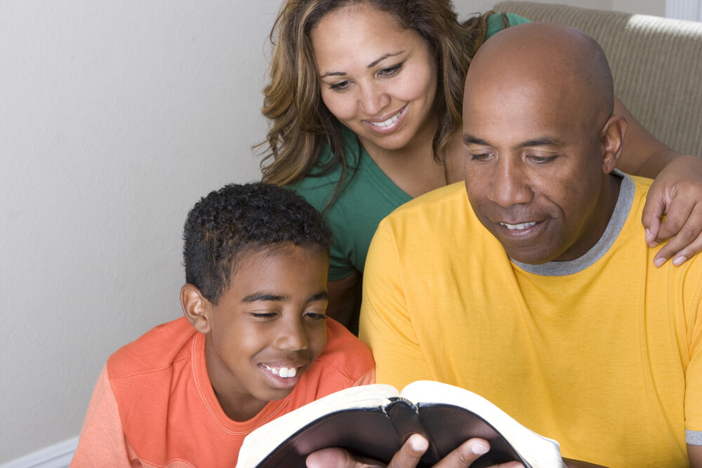 happy-family-studying-the-Bible-together