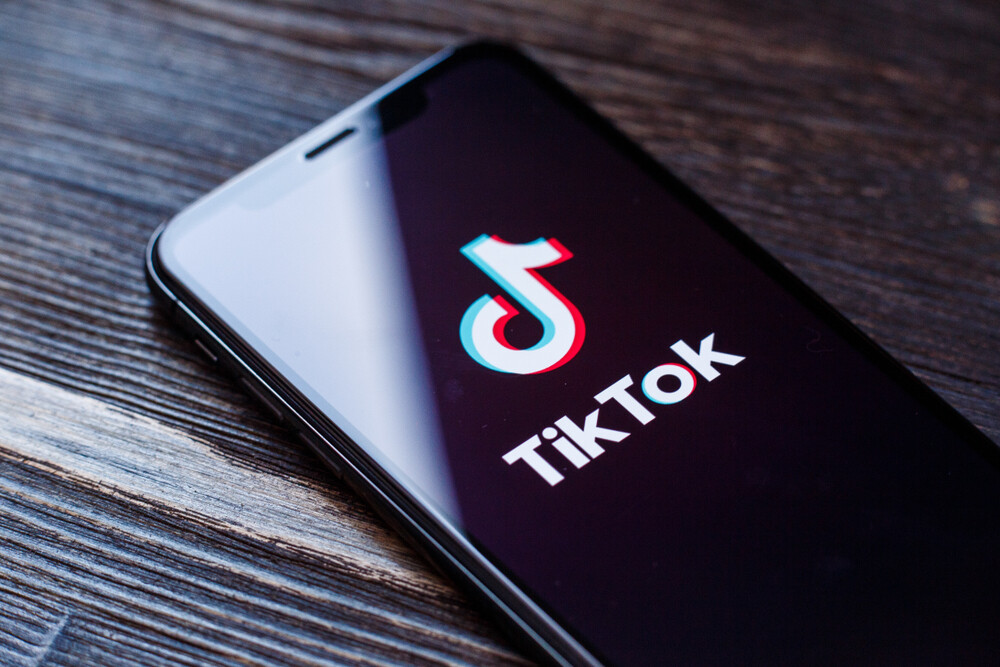 tiktok-name-and-logo-on-cell-phone-screen