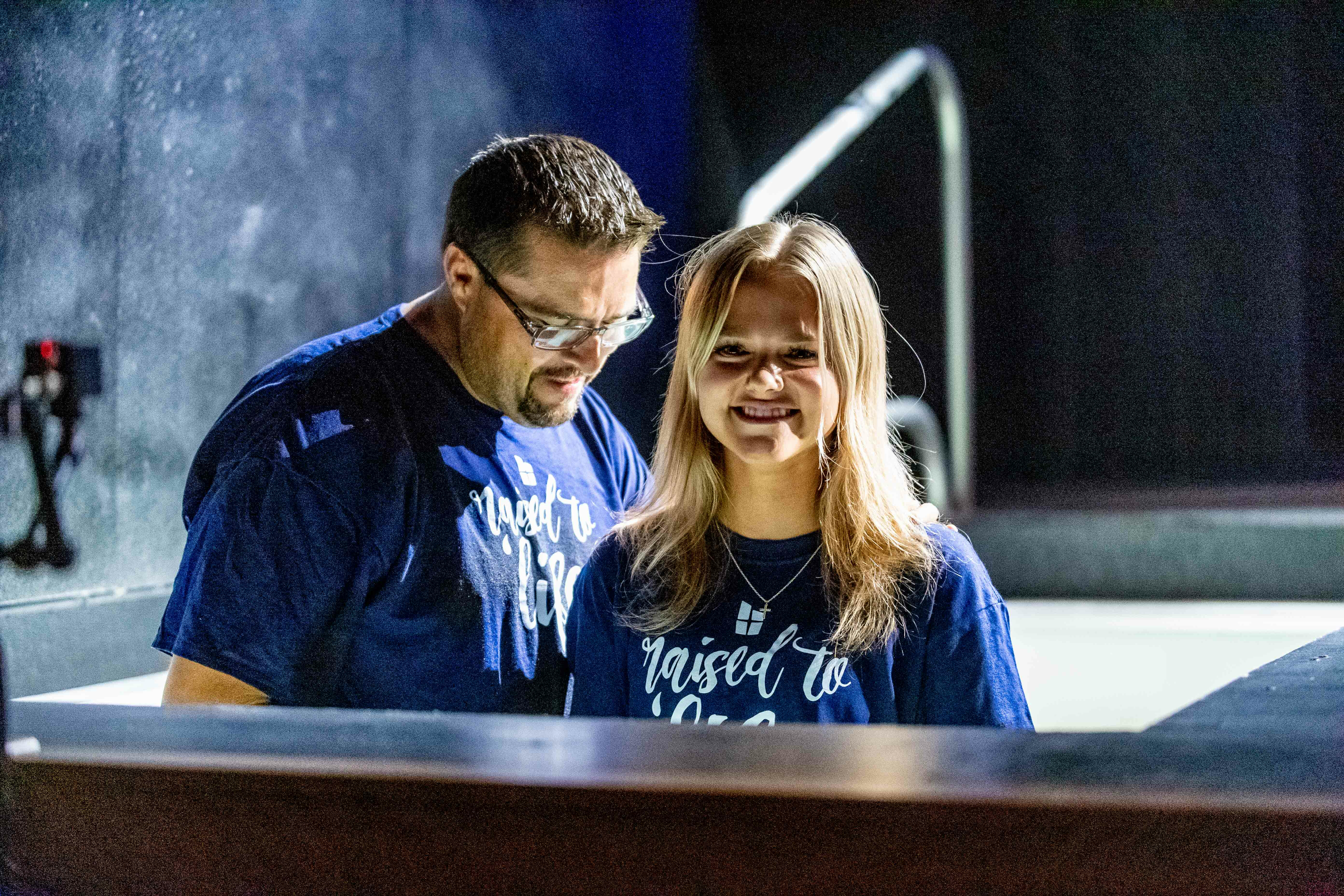 happy-teen-girl-getting-baptized-at-church