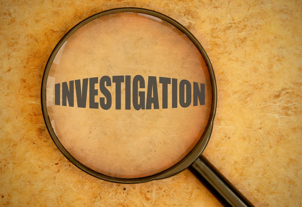 magnifying-glass-with-the-word-investigation