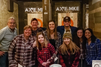 Young professional group outing an an ax throwing venue