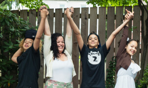 photo of a happy mom and kids celebrating