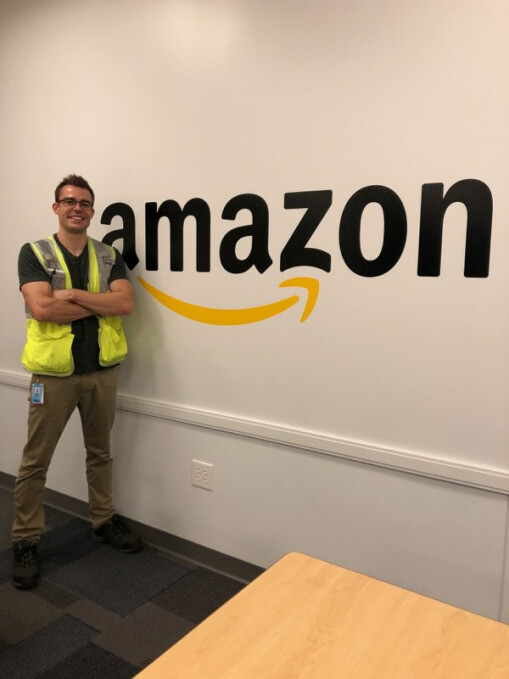 Dave Thompson standing in front of Amazon sign