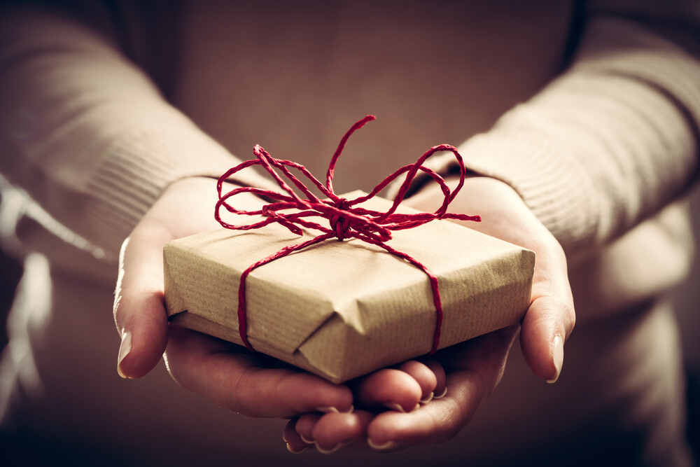 giving-a-gift-handmade-present-wrapped-in-paper