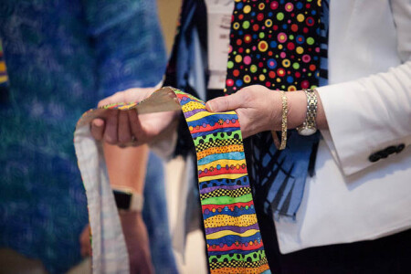 Supporters of full inclusion for LGBTQ clergy wore rainbow-colored stoles throughout Annual Conference. Several gathered in the hotel&rsquo;s main lobby area as a witness to their cause June 3.