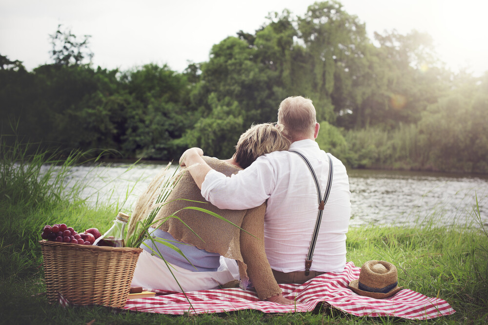 back-view-of-husband-and-wife-dating-on-a-picnic