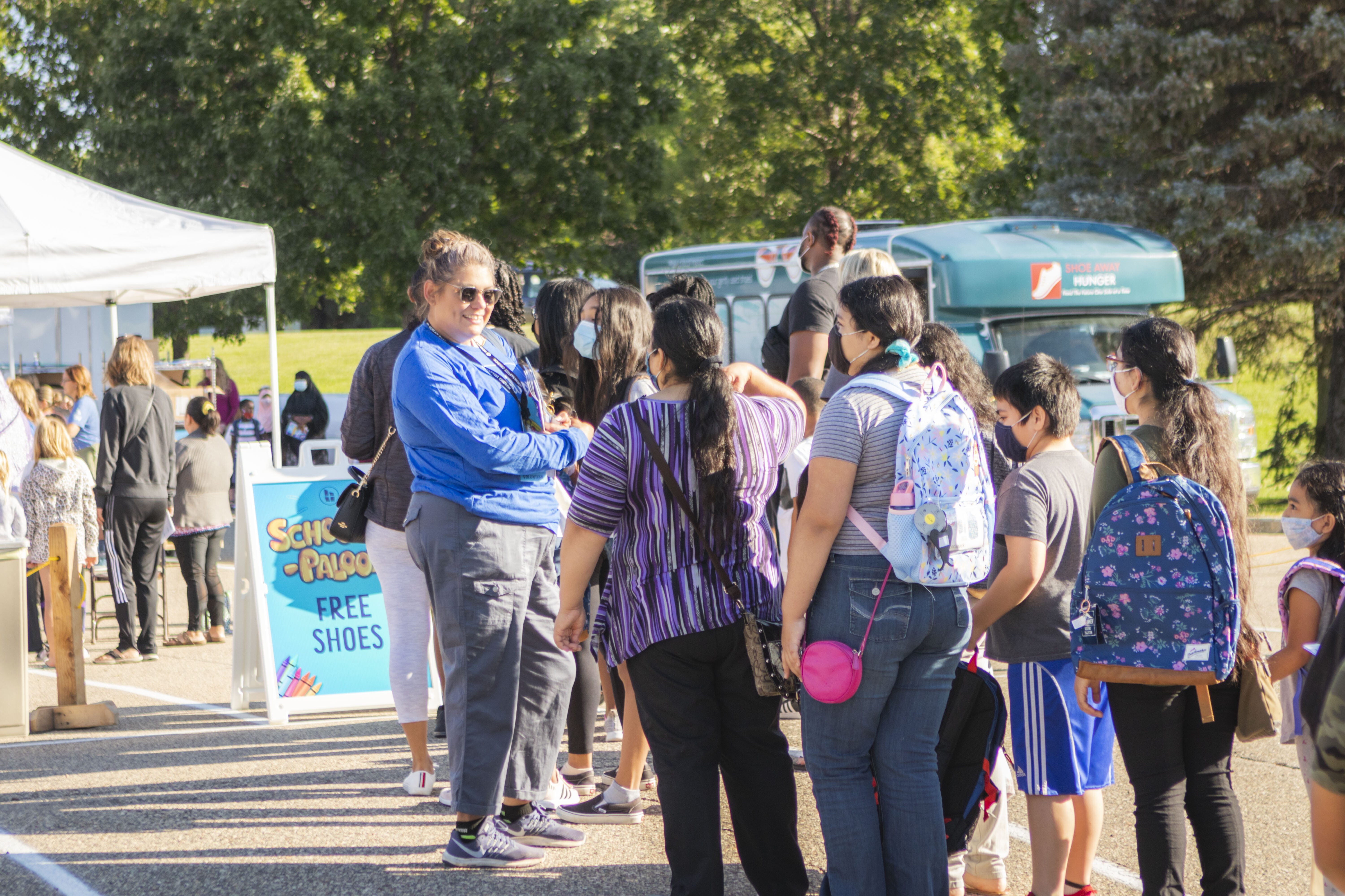 School-A-Palooza-volunteer-connecting-with-guests