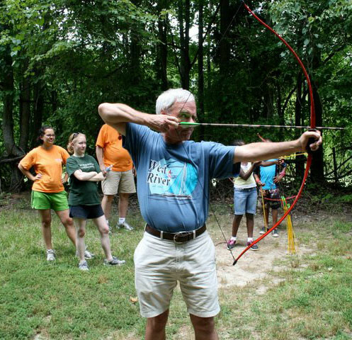 Thornton shows campers how it's done in archery at West River.