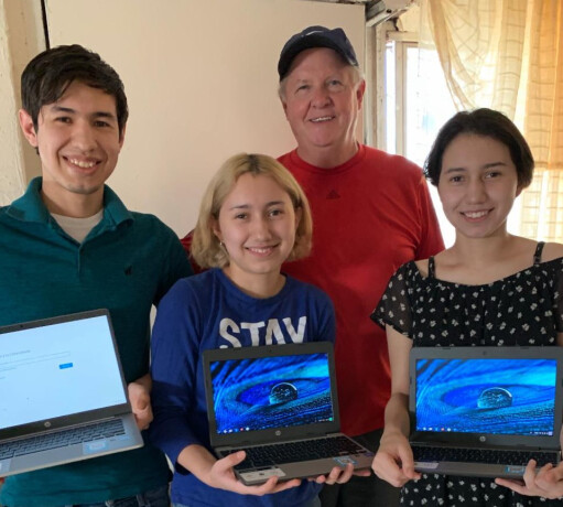 Jeff Pinar of M25MI presenting donated laptop computers to grateful students residing in an orphanage at Ciudad Juárez, Mexico.