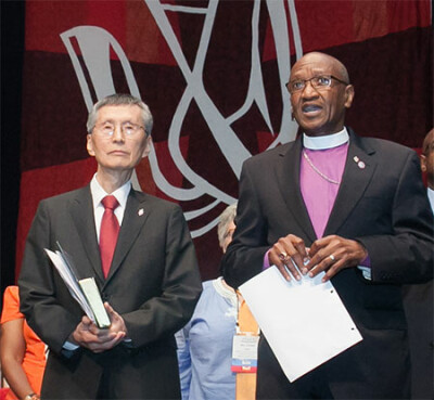 Bishop Marcus Matthews, right, introduces Bishop Young Jin Cho as Bible study leader.