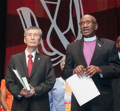 Bishop Marcus Matthews, right, introduces Bishop Young Jin Cho as Bible study leader.