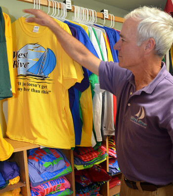 Thornton surveys t-shirts at the West River Camp store.