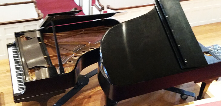 Two matching Steinway pianos with their tops open