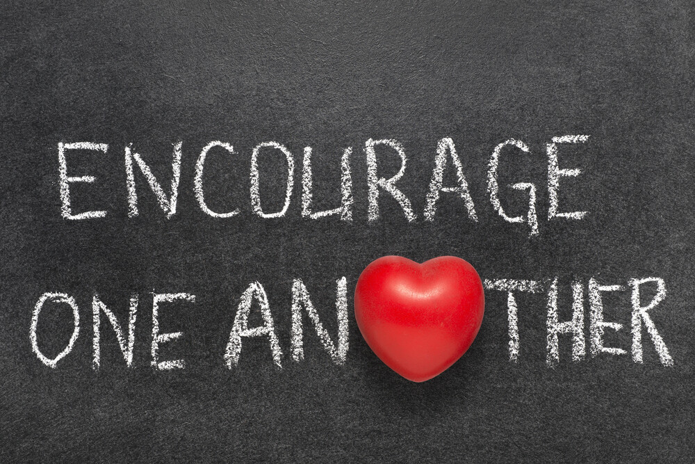 encourage-one-another-written-on-chalkboard-red-heart