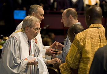 United Methodist Bishops Jack M. Tuell (left) and William B. Oden serve Holy Communion during opening worship at the 2008 United Methodist General Conference in Fort Worth, Texas. 