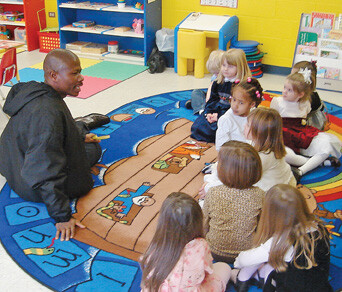 Victor Taryor talks to children at Westminster UMC during his recent visit.