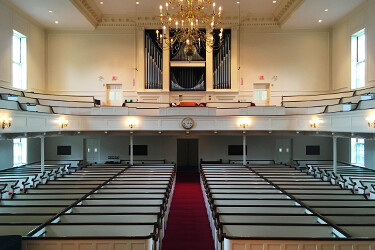 The sanctuary viewed from the pulpit, showing ample seating space on two levels
