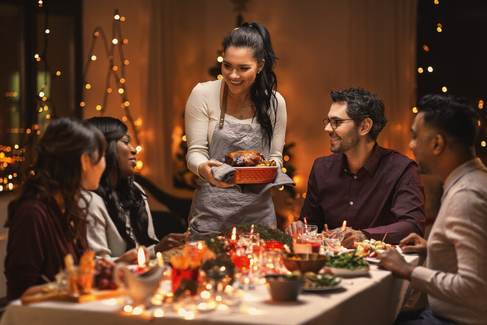 multi-ethnic-group-of-friends-enjoying-Christmas-dinner