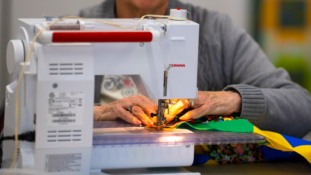 woman using sewing machine