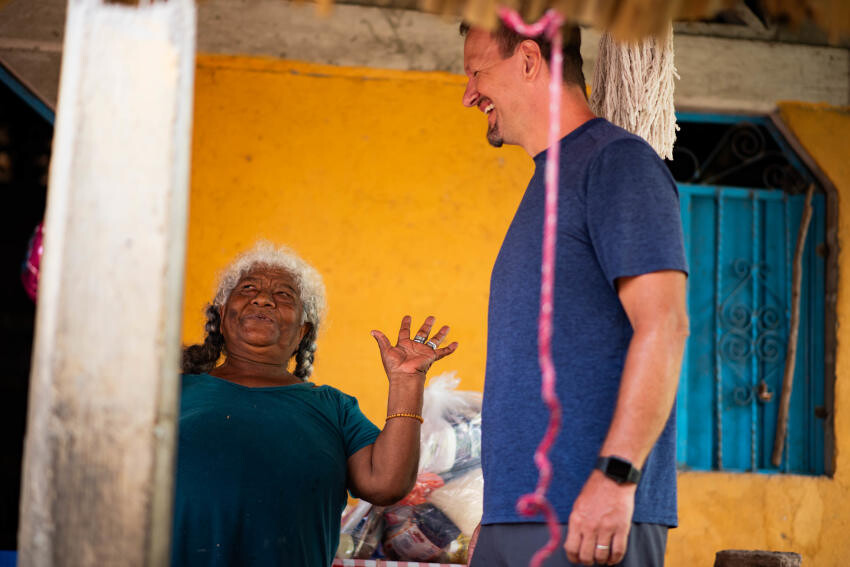 Local smiling with mission leader