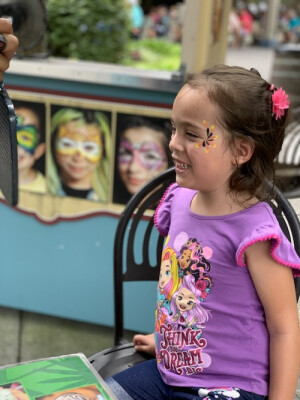 The Espinozas' daughter gets her face painted