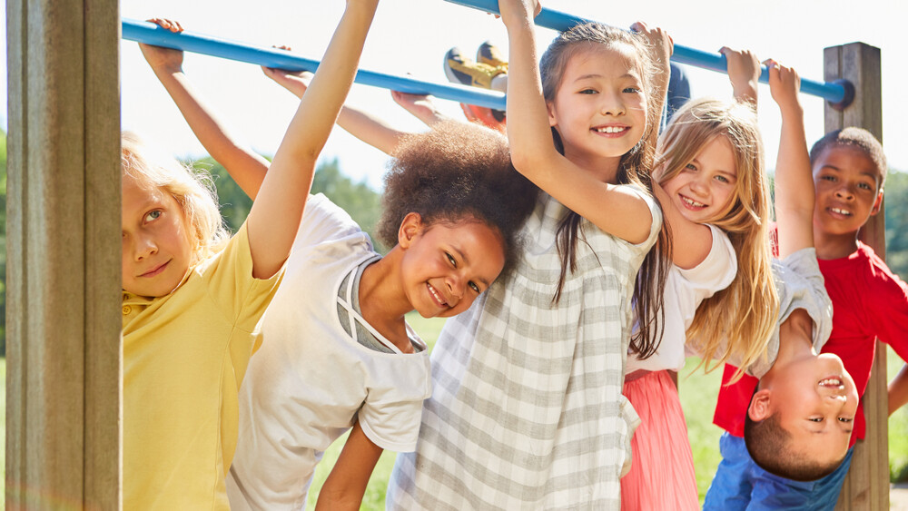 diverse-group-of-kids-having-fun-outdoors-on-a-playground