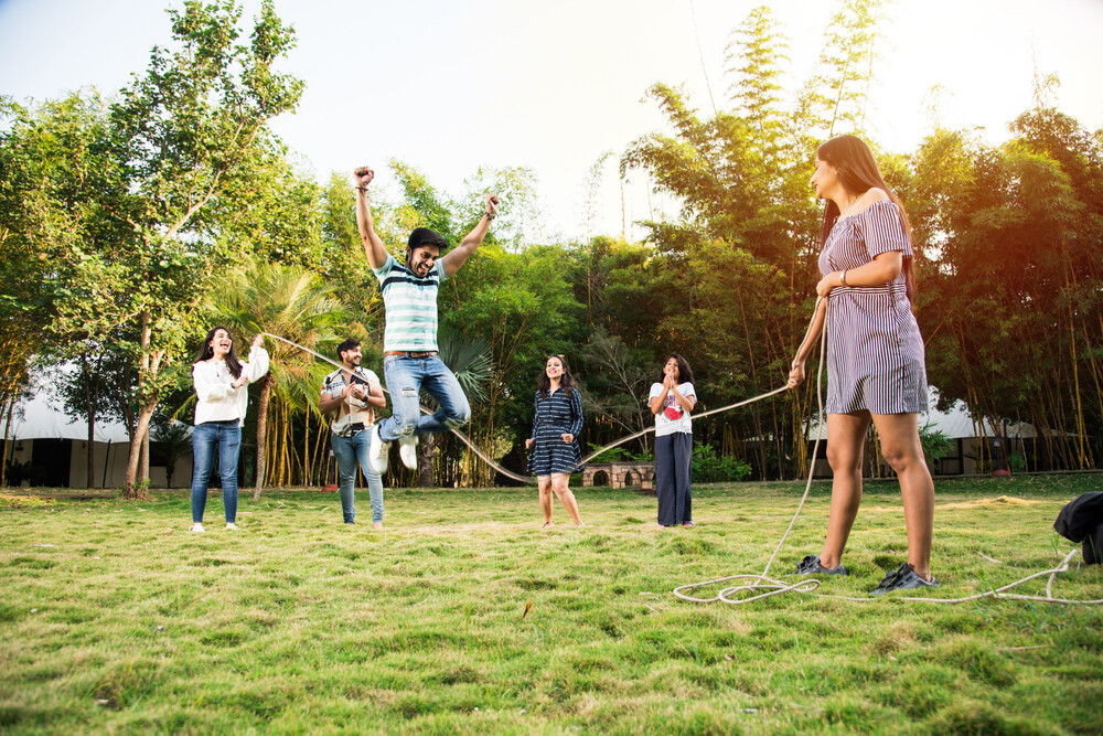 happy-group-of-young-adults-playing-a-game-in-the-backyard