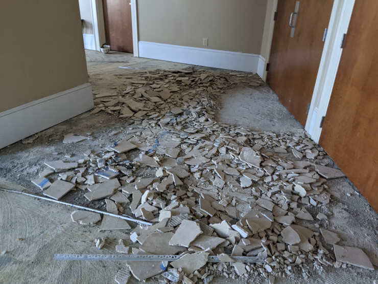 There were piles of broken tile that needed to be cleaned up and hauled away
