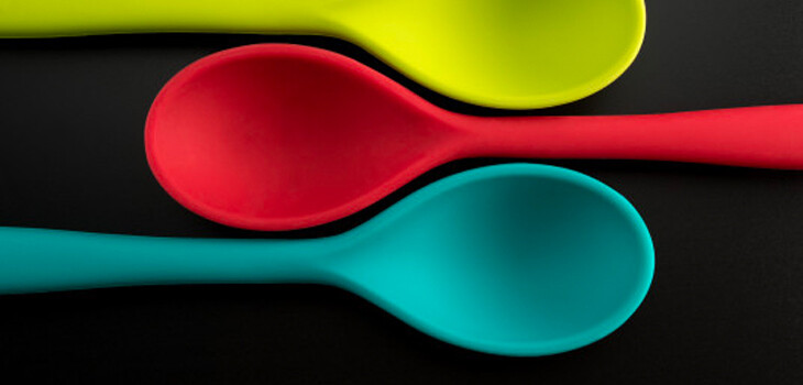 Three serving spoons in different colors
