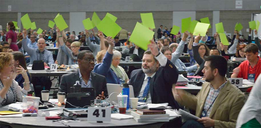 Faced with glitches in the electronic voting system, delegates use colored cards to vote on May 16 at the 2016 United Methodist General Conference in Portland, Ore. Photo by Paul Jeffrey, UMNS.