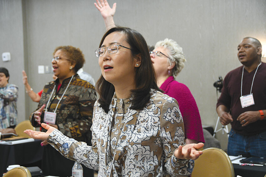 Pastor EunJoung Joo, of Washington Grove UMC, worships at the Multiethnic Church Conference in Oklahoma City March 30. Surrounding her are the Revs. Brenda Lewis, Laura Easto and George Winkfield. The two-day conference focused on becoming diversity-oriented so that the church can reflect the many faces of God. 