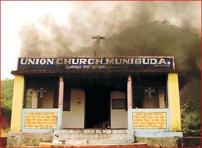 India, Orissa, burning church building