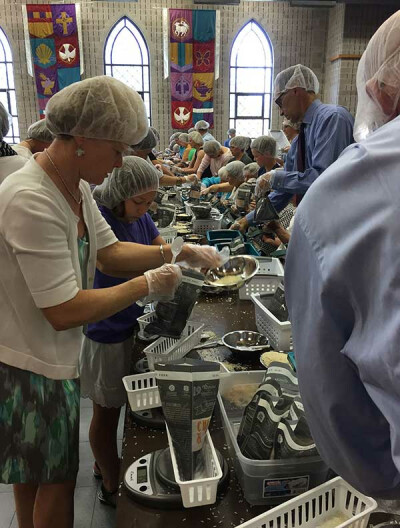Members of Pulaski Heights United Methodist Church in Little Rock, Ark., pack meals for hungry families in the state. The church is among the congregations growing in worship attendance. Photo courtesy of Andrea Wymes.