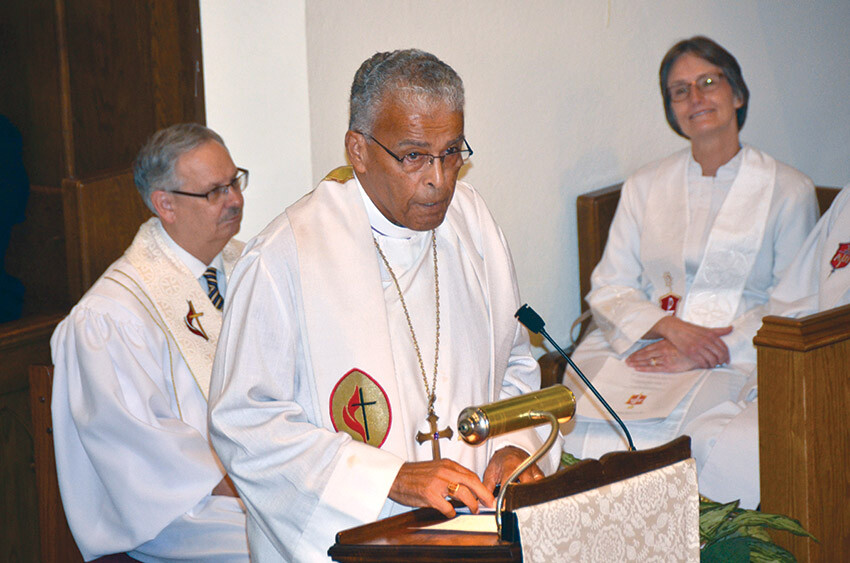 Bishop Herbert Skeete, center, preaches the eulogy at the Celebration of Life service for Bishop May. Bishops Bruce Ough (left) and Sandra Steiner-Ball look on.