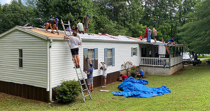 high schoolers doing roof repairs
