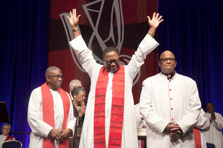 The Rev. Marvin Wamble celebrates after being ordained an Elder during services Saturday morning, June 4.