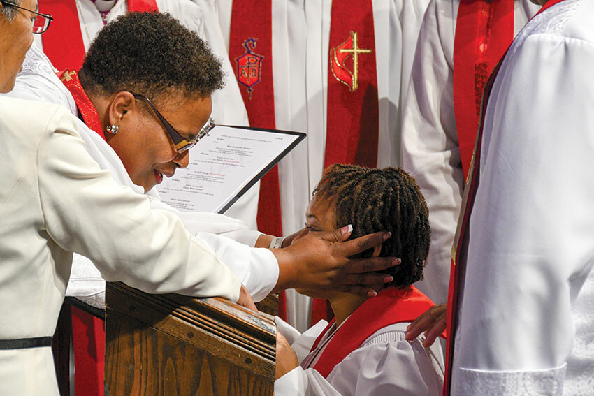 Bishop LaTrelle Easterling, left, shares a blessing with the Rev. Selena Johnson during the ordination service.