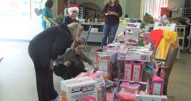 People picking toys for their children