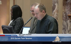 Pastor John leads opening prayer on April 19 at Minnesota State Senate Session