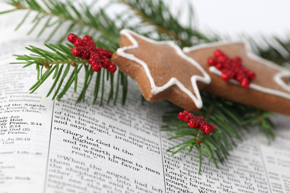 close-up-of-Christmas-story-in-the-Bible-with-pine-Christmas-branch