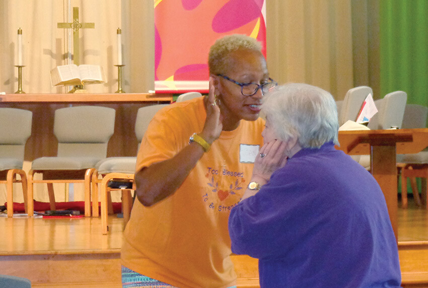 The Revs. Joan Carter-Rimbach, left, and Nancy Webb dance at the reunion of the BWC’s Clergywomen Choir in September.