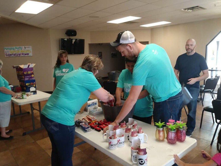 Volunteers assembling baskets Volunteers assembling baskets