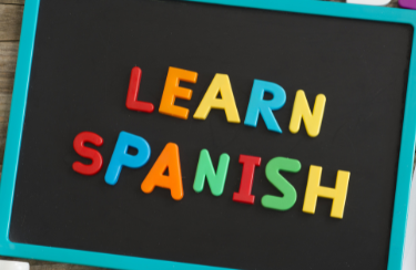learn Spanish spelled with magnetic letters
