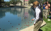 Canon placing flower in the Reflection Pool